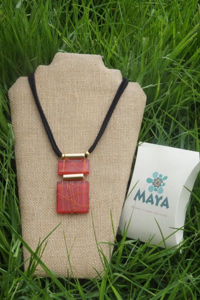 Red glass necklace copper fabric